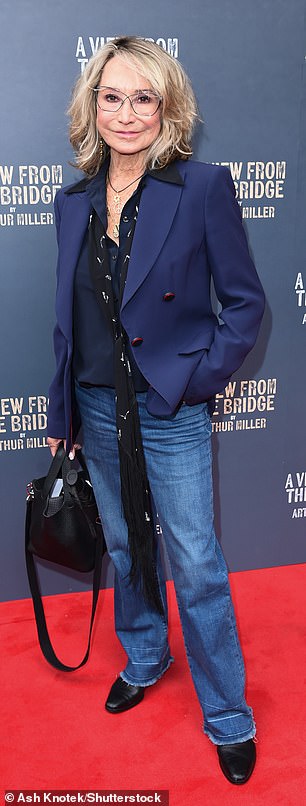 Felicity, 77, kept it more casual in a navy blazer which she paired with blue jeans.