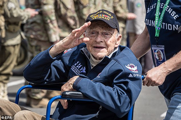 Veteran André Chappaz greets the public upon arrival at the solemn tribute