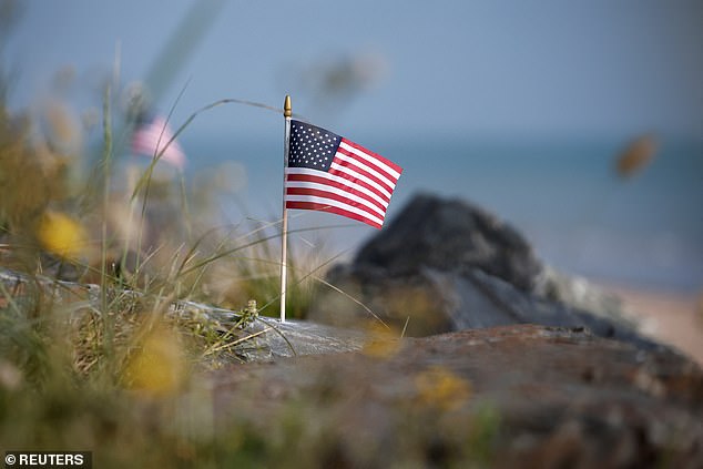 An American flag stands alone on Omaha Beach ahead of the 80th anniversary event