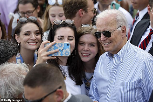 Biden stopped to take selfies at the event