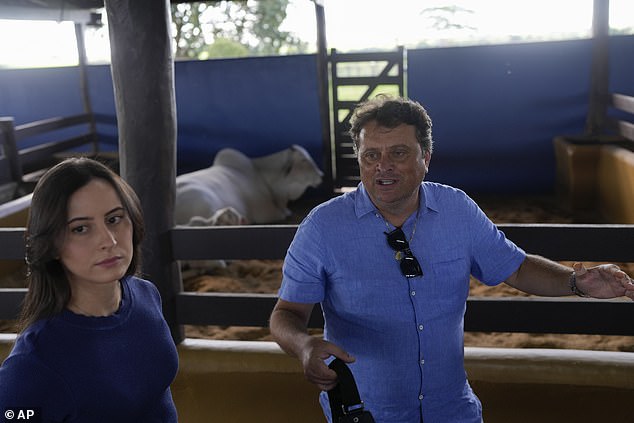 Ney Pereira and her daughter, veterinarian Lorrany Martins, give an interview inside a stable on their farm in Uberaba, Minas Gerais state, Brazil.