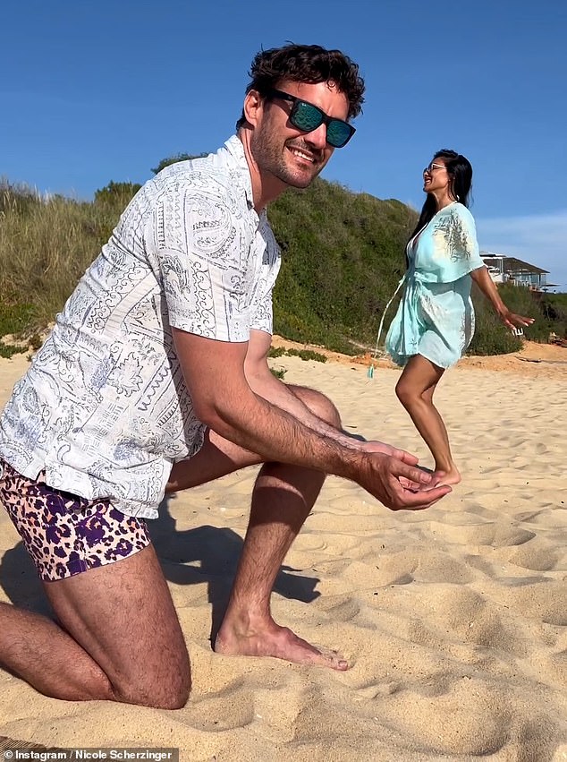 The sweet video showed Nicole and Thom posing perfectly for the camera to give the illusion that they were sharing a kiss.