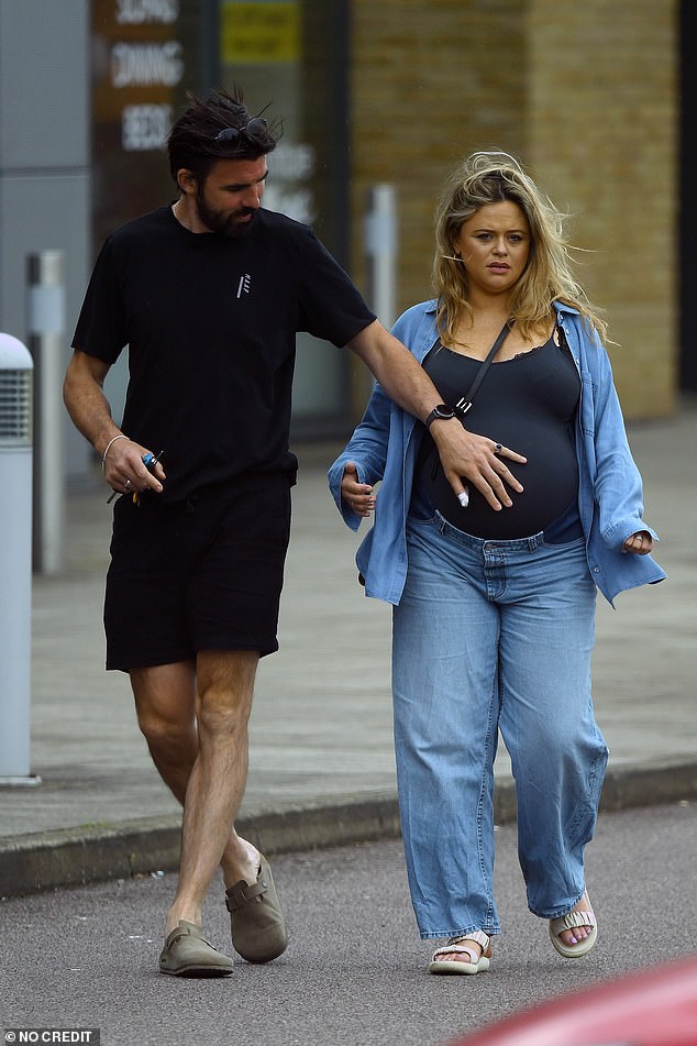 At one point, her partner gracefully placed her hand on her belly during their healthy walk.