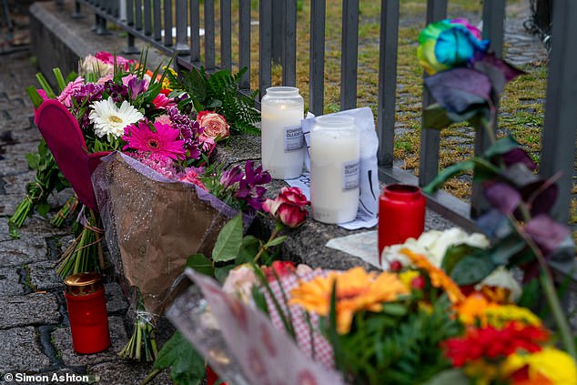 Flowers and candles are left in the city center of Mannheim as a tribute to the victims of the attack.