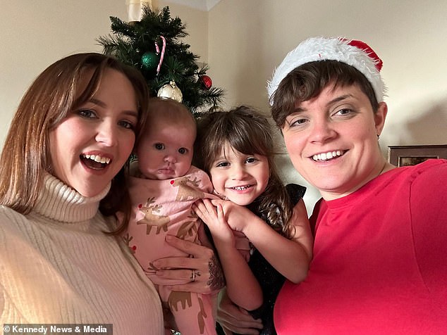 Isabella's mother, Adele Telford (left), 31, said that the moment she found out Isabella had swallowed the battery, she and her wife Emily (right) had to rush her to hospital. The couple is pictured here with Isabella and one of her other children, eight-month-old Everley.