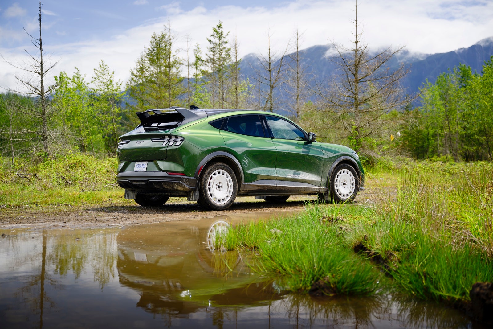 Ford MachE Rally racing down a dirt road