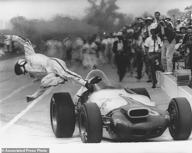 Jones is thrown from his car after it caught fire in the pits during the Indy 500 race in May 1964.