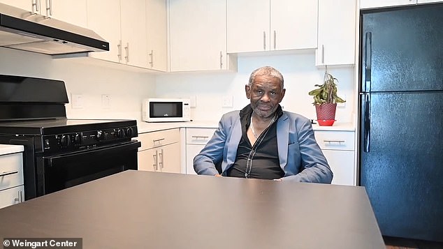 In a YouTube video shared by the Center in April, Keith Corley is very happy sitting in his new apartment, which has a fully furnished kitchen.