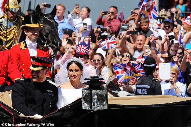 Prince Harry and Meghan Markle travel through Windsor after their wedding ceremony at St. George's Chapel at Windsor Castle.