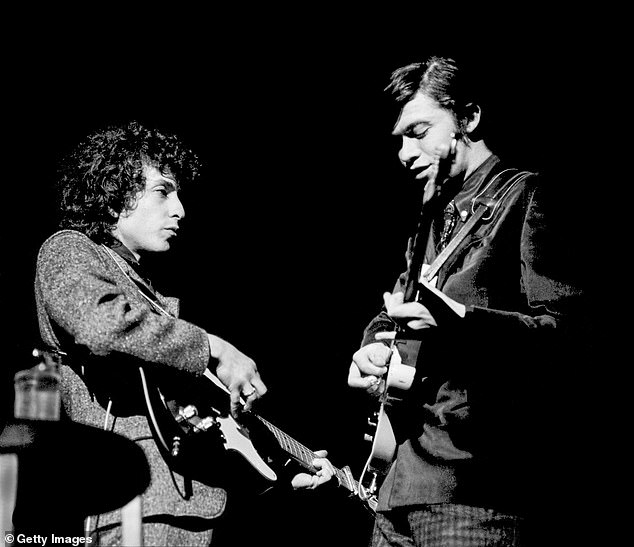 A Complete Unknown, which is directed and co-written by James Mangold, does not yet have a release date; Dylan seen with Robbie Robertson of The Band in 1966 in Philadelphia