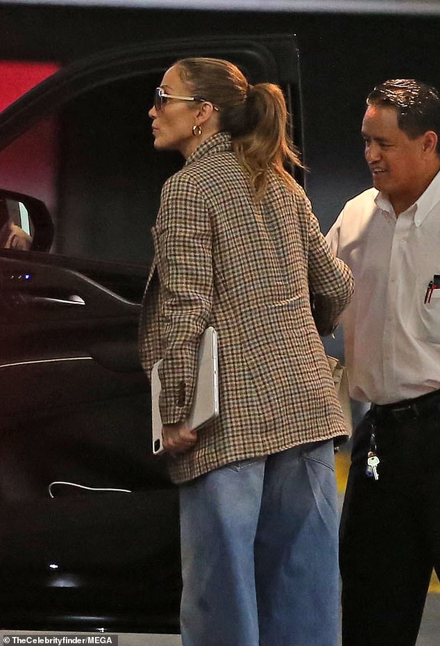 The Atlas star, 54, cut a stylish figure as she kept up with her busy schedule, wearing a plaid jacket and oversized blue jeans.