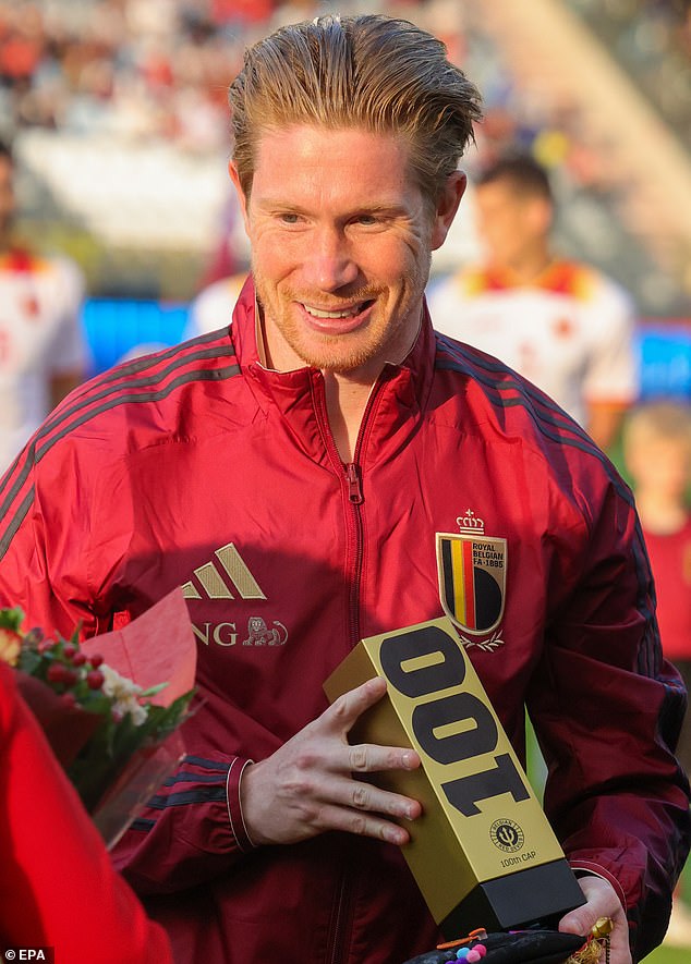 De Bruyne received a trophy for his 100th match while his wife received some flowers