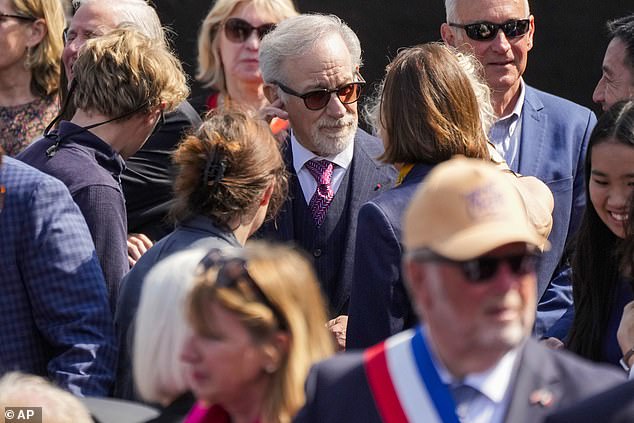 Hours later, both Tom and Steven were photographed at the Normandy American Cemetery and Memorial in Colleville-sur-Mer, overlooking Omaha Beach.