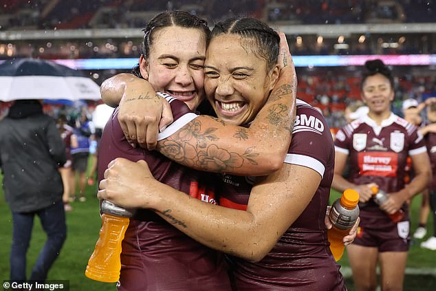 Maroons' Jessika Elliston and Shannon Mato celebrate victory in game two of the Women's State of Origin series