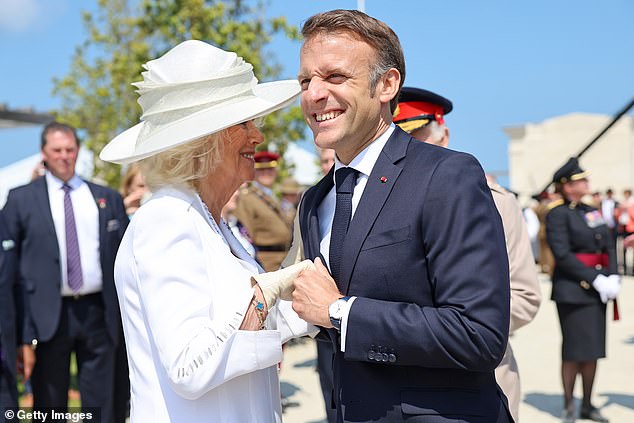 President Macron also made a charming display of squeezing Queen Camilla's hand.