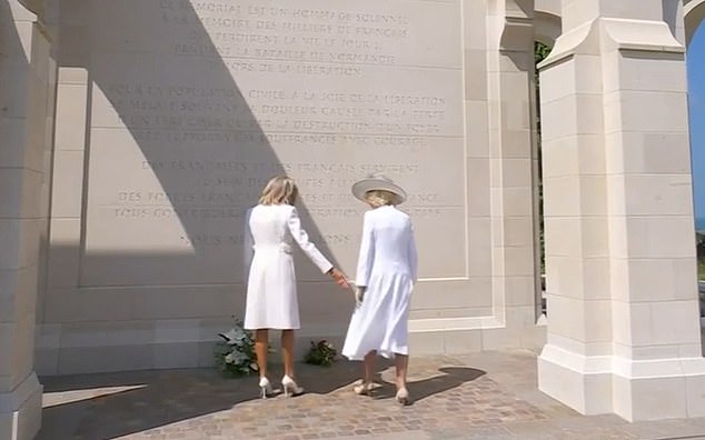 After placing her flowers at the British Normandy Memorial in Ver-sur-Mer, the First Lady approached the Queen, but Camilla seemed somewhat reluctant to offer her gloved hand.