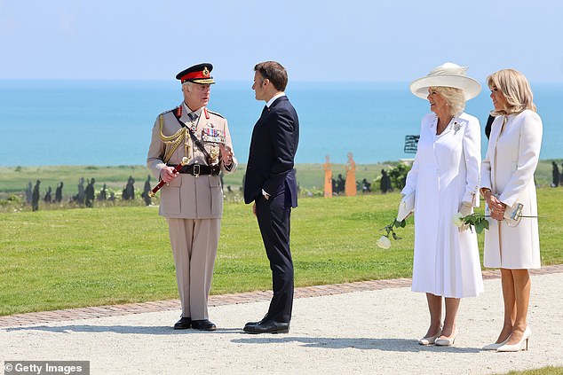 The group chatted among themselves during the commemorative event in Normandy