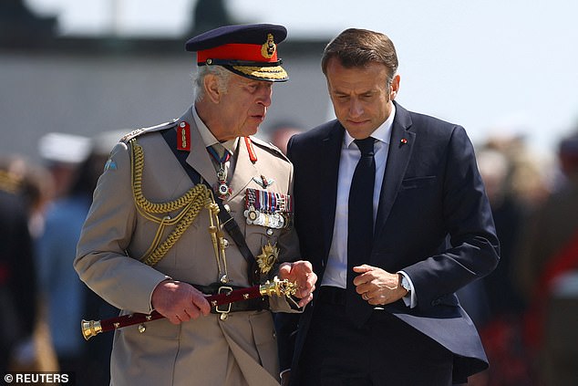 Macron listened attentively as the King spoke to him at the historic event.