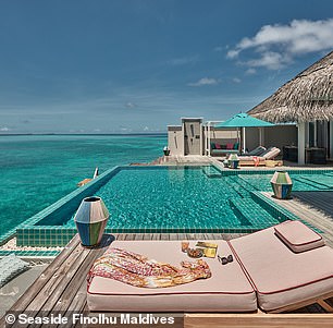 The 'rockstar villa' (pictured) including a living room, outdoor patio, large pool, stairs to the ocean and a personal host.