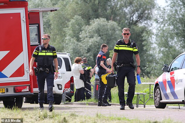 Investigators and emergency services in Lelystad, where Rayan's body was pulled from a canal.