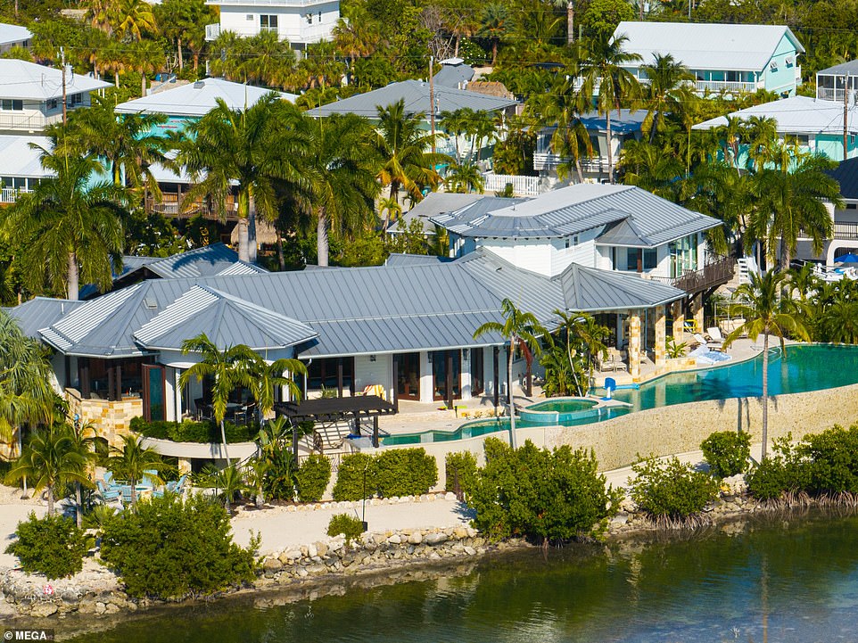 The star's new infinity pool features a swim-up bar with underwater stools, perfect for a relaxing day after working on a movie set.