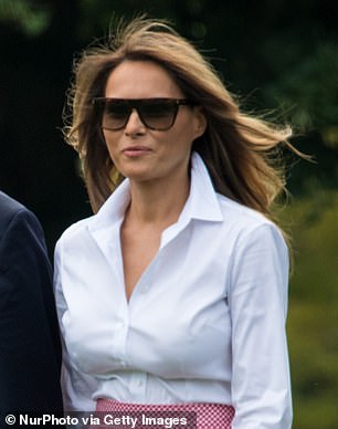 Melania opted for a white shirt on a trip to Trump National Golf Course in 2017.