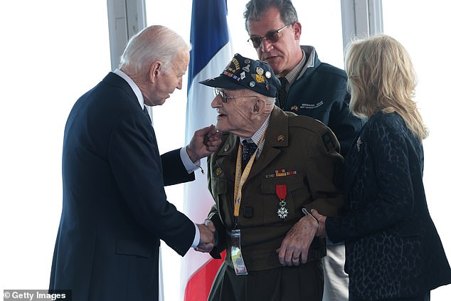 Biden reveled in their company, handing out specially commissioned challenge coins and joking with them.