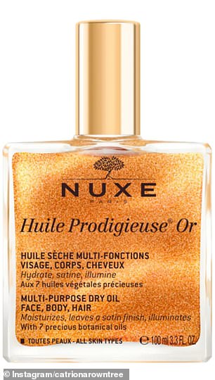 She picked up a bottle of NUXE Huile Prodigieuse Or, a luxurious shimmering oil for face, body or hair.