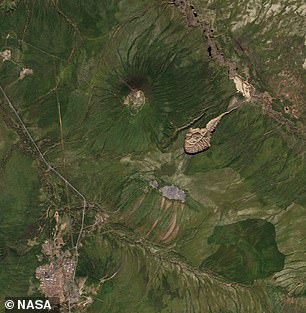 Above, a 2016 NASA satellite image of the expanding Batagaika Crater.