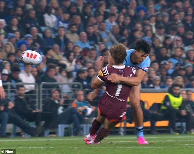 Sua'ali'i knocked Walsh out with the sickening punch (pictured) and was sent off, paving the way for Queensland's easy 38-10 win over the Blues on Wednesday night.