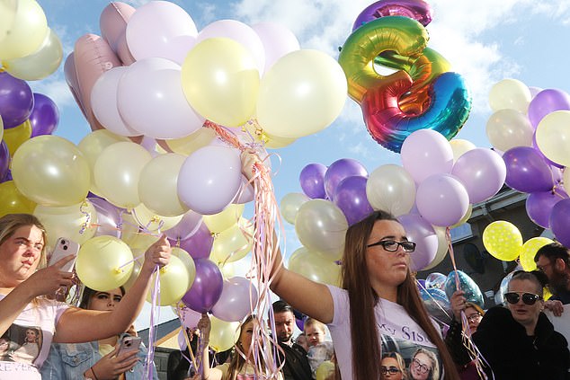 Morey's sister, Jolene Morey, led a countdown at the vigil before hundreds of colorful balloons were released into the sky and a selection of Morey's favorite songs played over a loudspeaker.