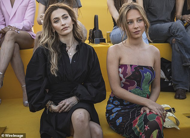 Paris sat in the front row of the show with the Spanish actress and model Ester Expósito, who wore a multicolored strapless dress