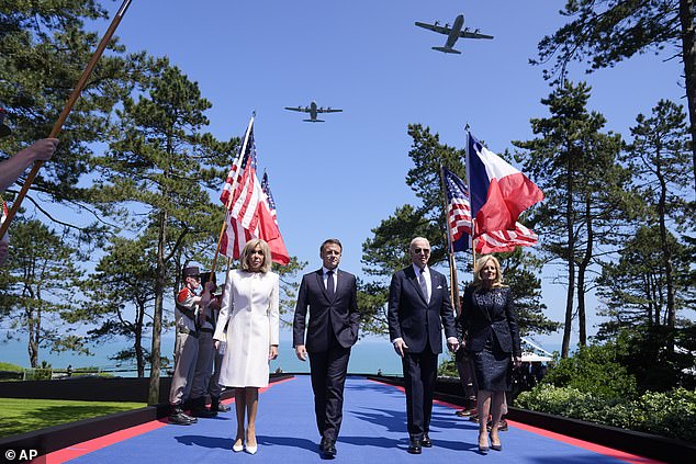 President Joe Biden, first lady Jill Biden, French President Emmanuel Macron and his wife Brigitte Macron take the stage during ceremonies to mark the 80th anniversary of D-Day.