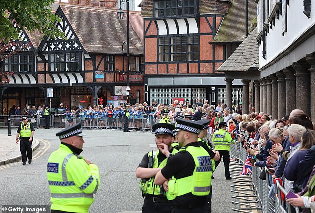 A general view of police and their supporters as they line the street near the cathedral.