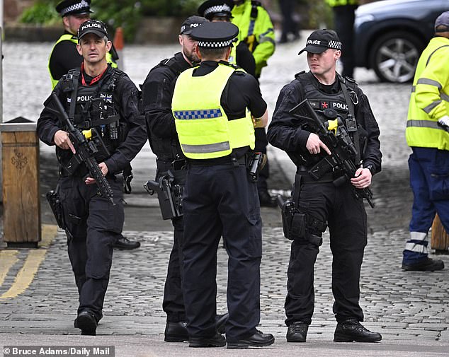 Police officers outside Cheshire Cathedral today before the ceremony