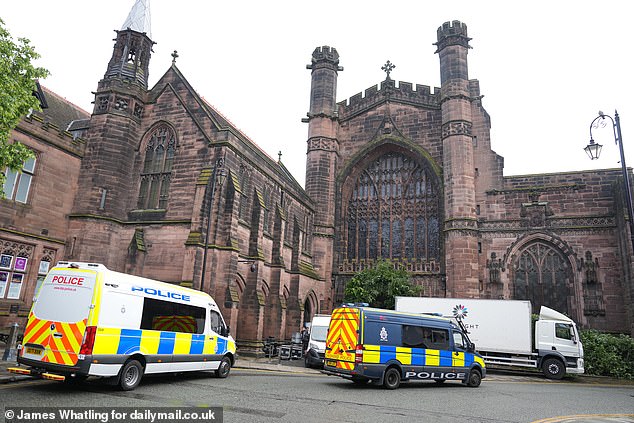 Police vans at Chester Cathedral, where the wedding ceremony will take place.