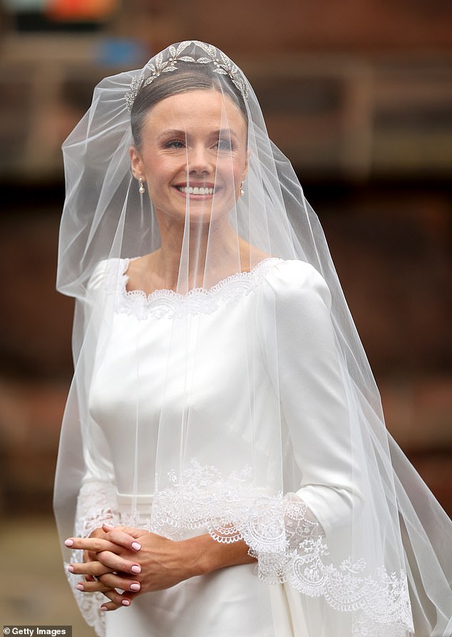 Olivia Henson arrives at her wedding to Hugh Grosvenor, the Duke of Westminster, at Chester Cathedral.