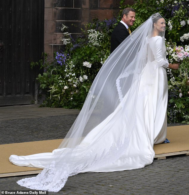 Olivia Henson in her wedding dress outside the Cathedral for her wedding to Hugh Grosvenor