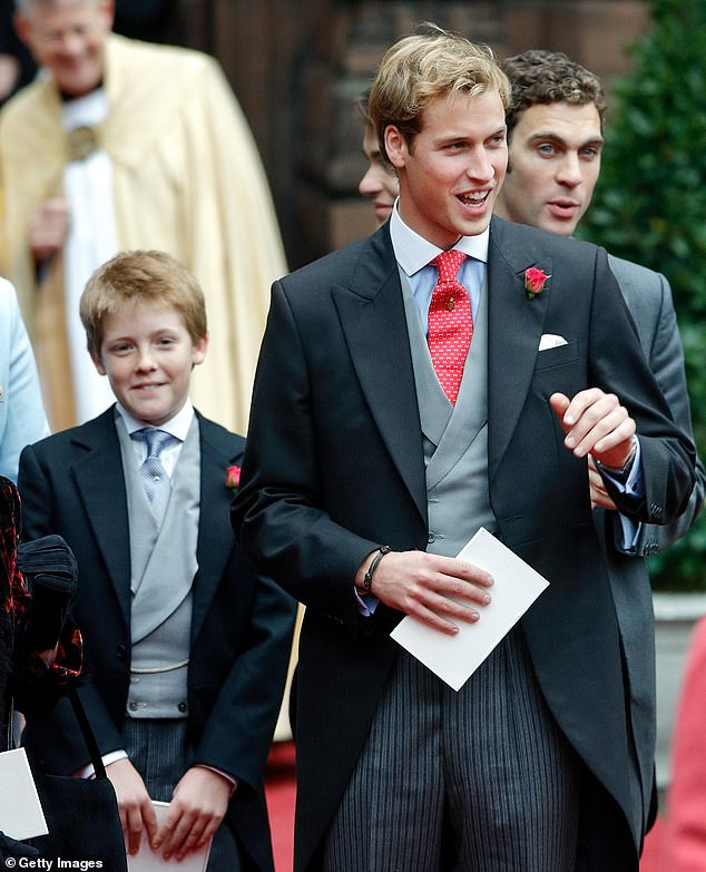 The 7th Duke, aged 33, as a child with a mischievous smile on his face alongside his lifelong friend William.