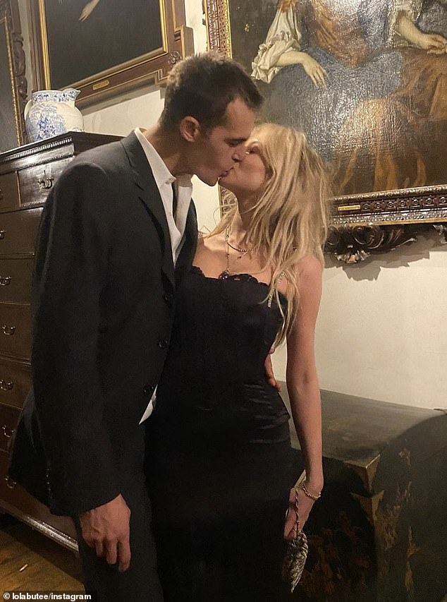 Lady Lola looked incredible in a satin black dress on New Year's Eve as she posed for sizzling photos with her new boyfriend.