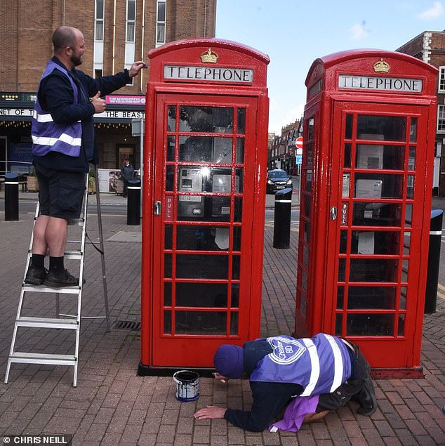 Workers were also seen touching up red telephone boxes in Chester city center ahead of the wedding.