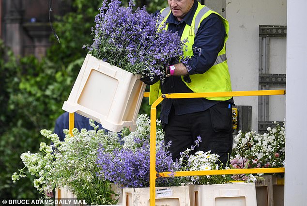 Flowers are delivered and taken to Chester Cathedral on Thursday