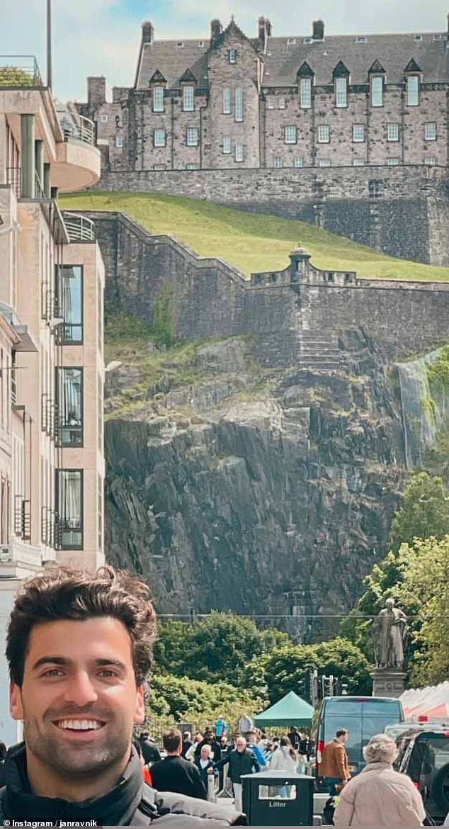 Jan Ravnik, one of Taylor's many backup dancers, was seen taking a photo today in front of Edinburgh Castle.