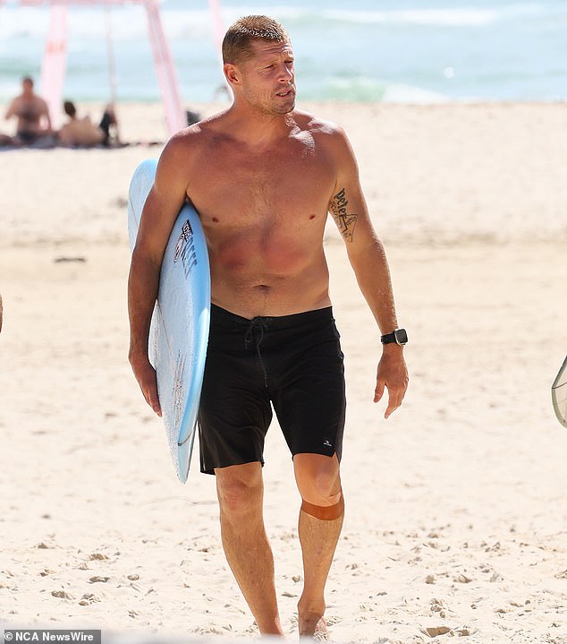 Australian surfing legend Mick Fanning (pictured) appears at a memorial to his brother Edward at the Greenmount Beach Surf Club on the Gold Coast on April 6, 2024.