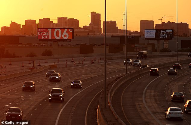 A sign shows the current temperature of over 100 degrees this week in Phoenix, Arizona.