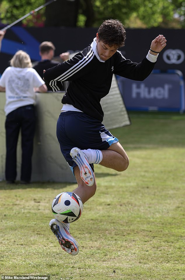 Bobby, 21, wore a navy blue Adidas tracksuit and shorts as he showed off his kicking skills.