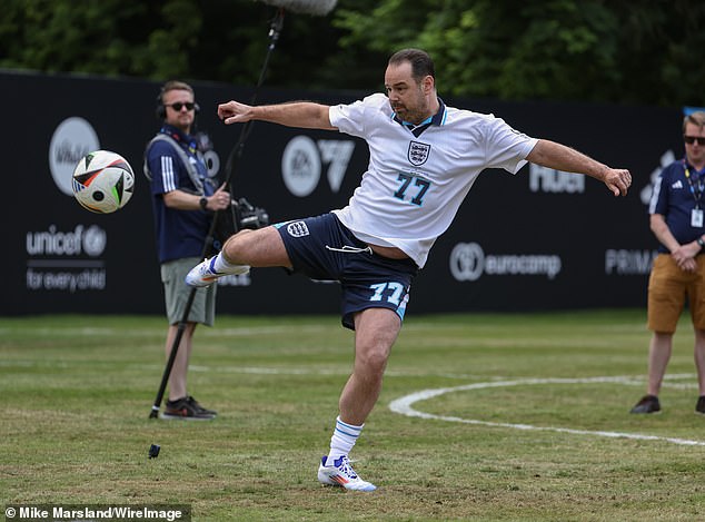 Danny, 46, was sporting his full uniform, including a white and blue UNICEF football shirt, shorts and football boots.