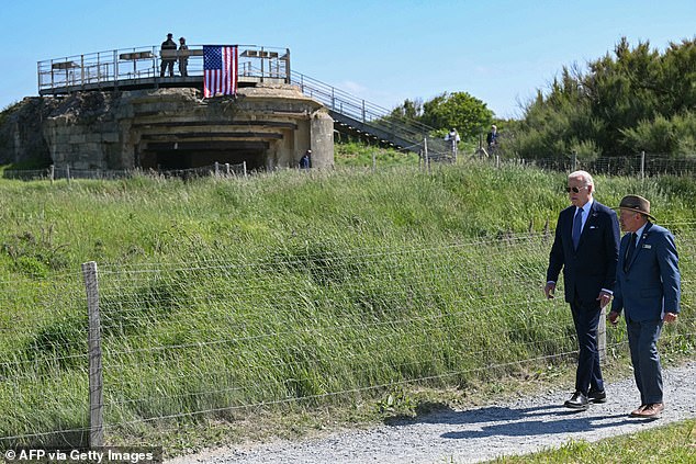 The Pointe du Hoc was one of the strongholds of the German fortifications and was taken by force in a daring vertical assault. Biden is guided by the superintendent of the Colleville-sur-Mer American Cemetery, Scott Desjardins.