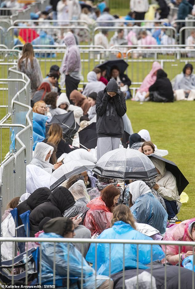 Fans braved miserable Scottish weather as they queued for concert in Edinburgh