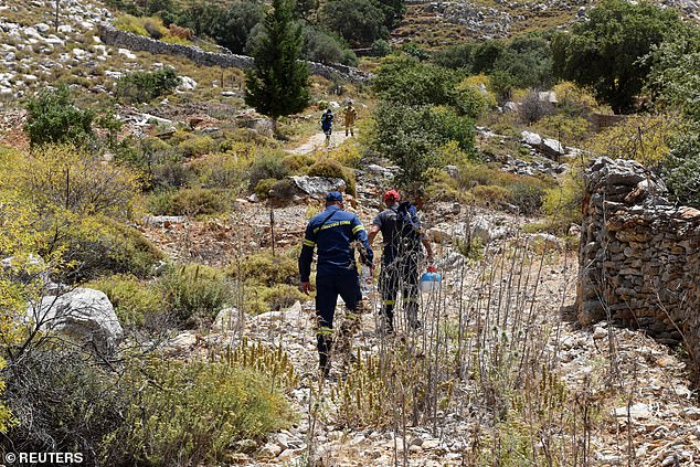 Fire Department officers inspect an area following the search for missing British television doctor Michael Mosley.